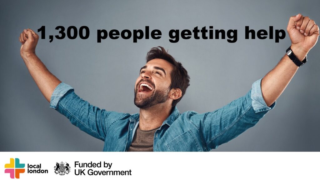 Smiling man holding arms aloft with text that says 1300 people getting help