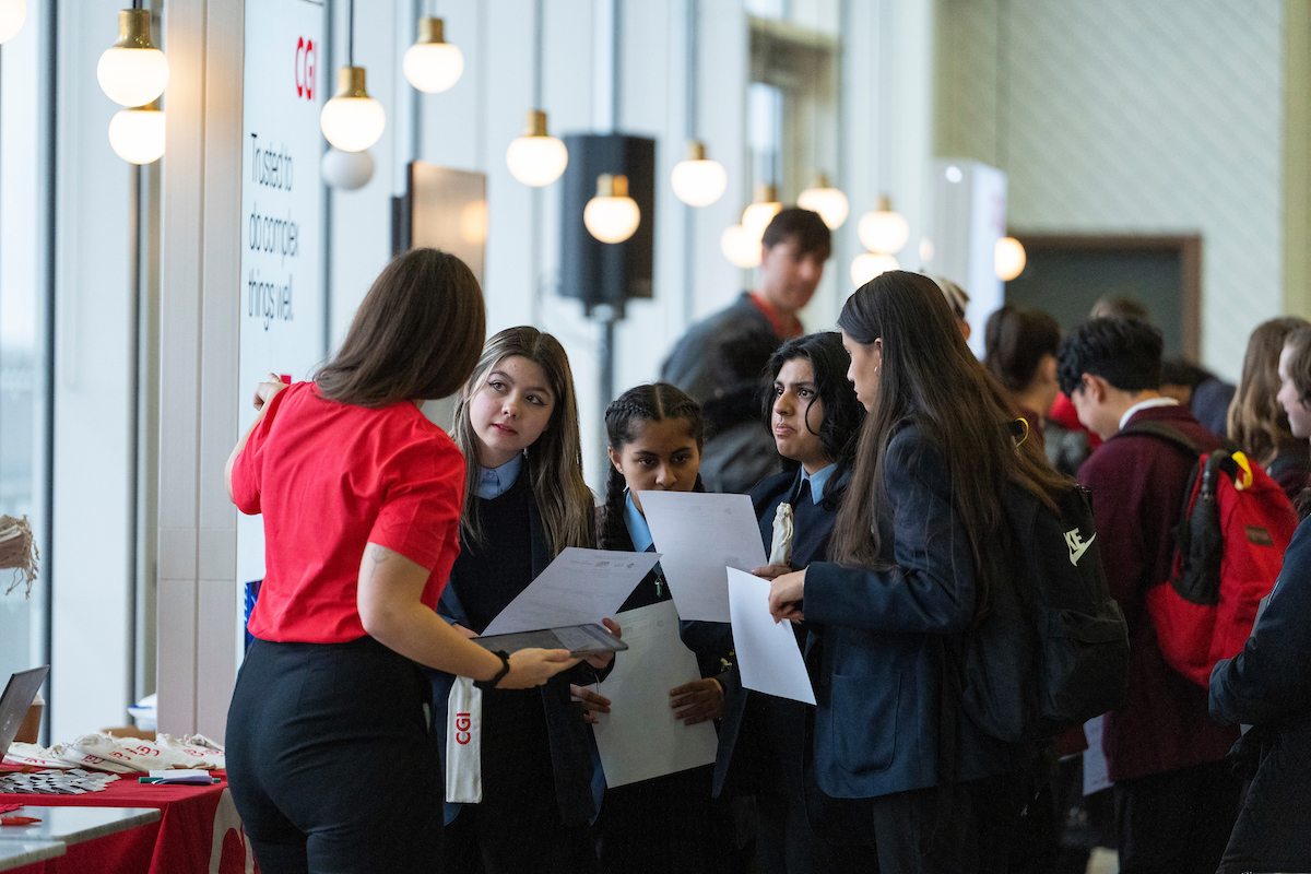 Decorative: students talking to employer