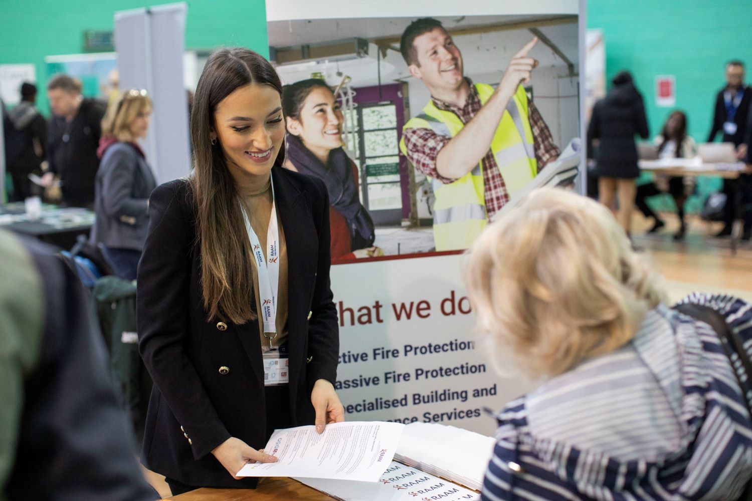 Enfield Jobs Fair 2 Decorative: woman speaking to job seeker at one of our recruitment fairs